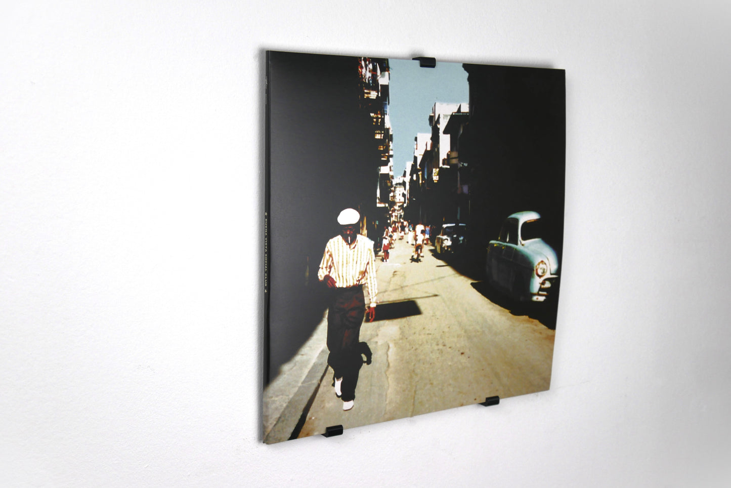 Self-Adhesive Vinyl Wall Mount displaying a record, highlighting its sleek design and compatibility with vinyl albums, perfect for elegant home decor.