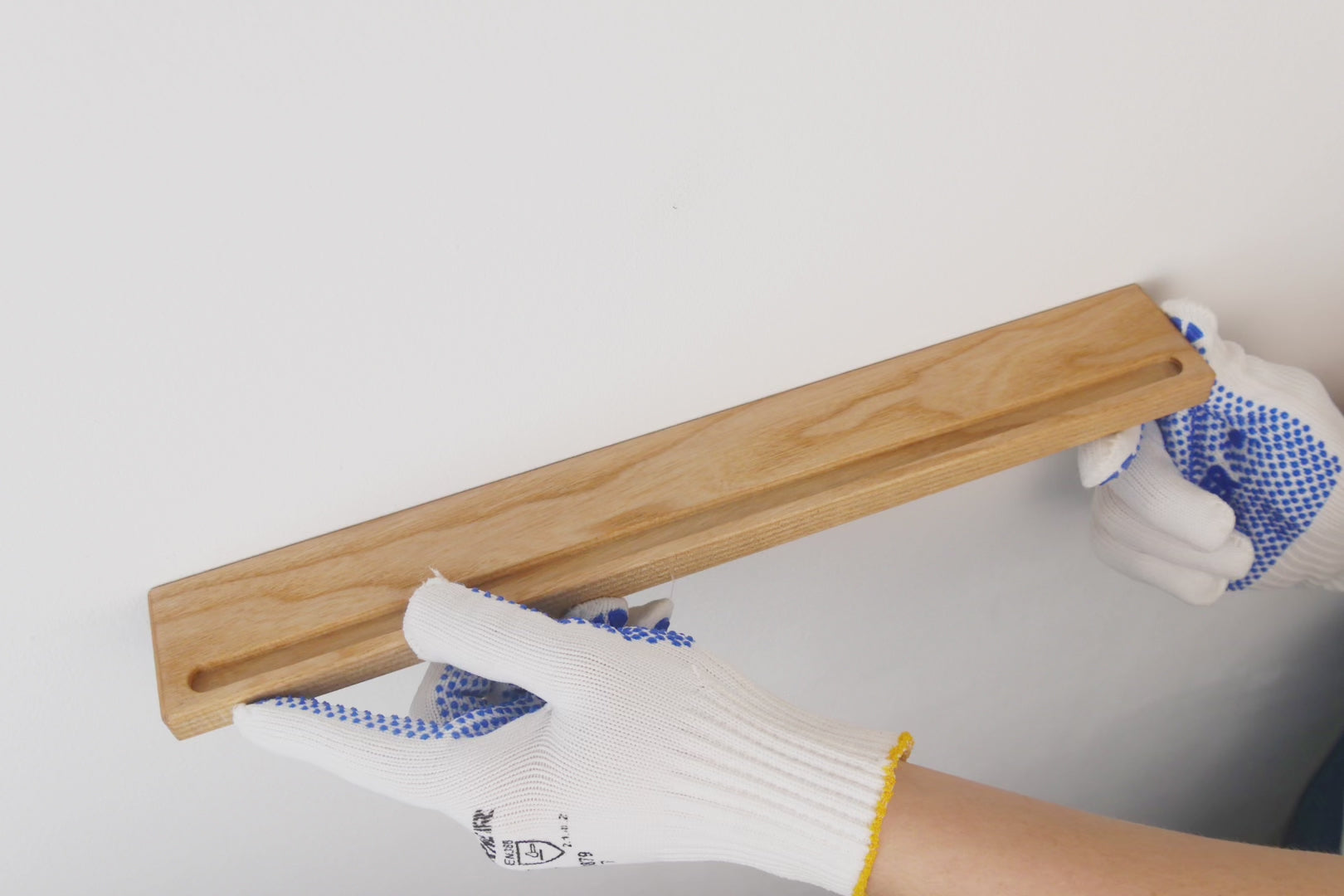 Installation video for Handmade Wooden Vinyl Record Wall Mount, showcasing easy setup process with provided screws and dowels for secure vinyl record storage.