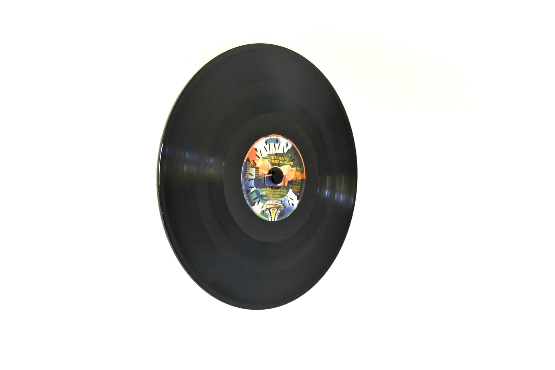 Innovative vinyl record wall mount with cover holder